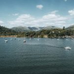 Boats along the edge of the lake on a sunny day