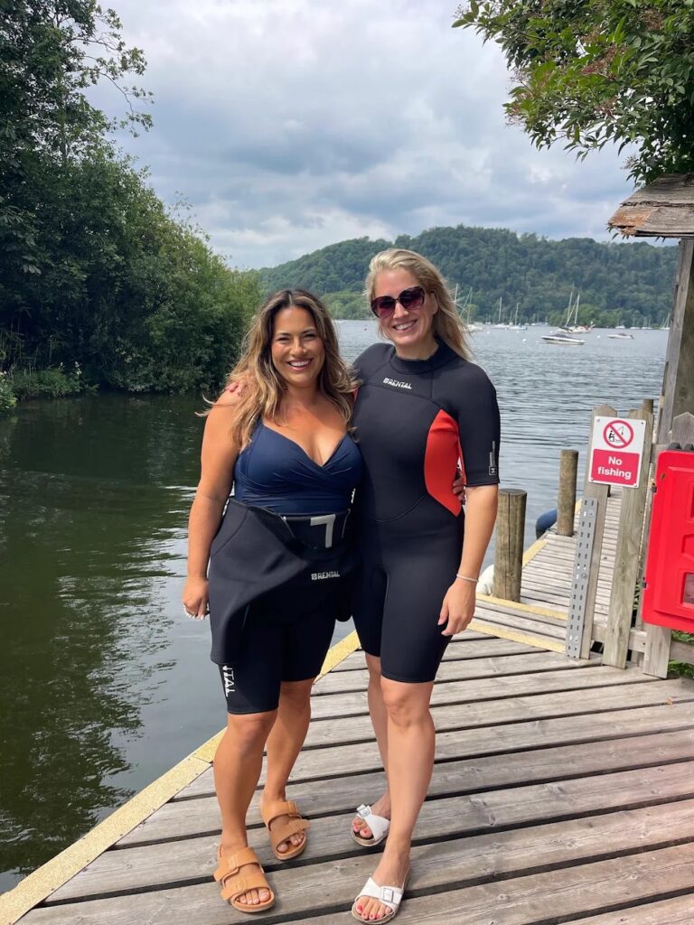 Claire and Jojo waiting to wakesurf at the Windermere Marina on a sunny day